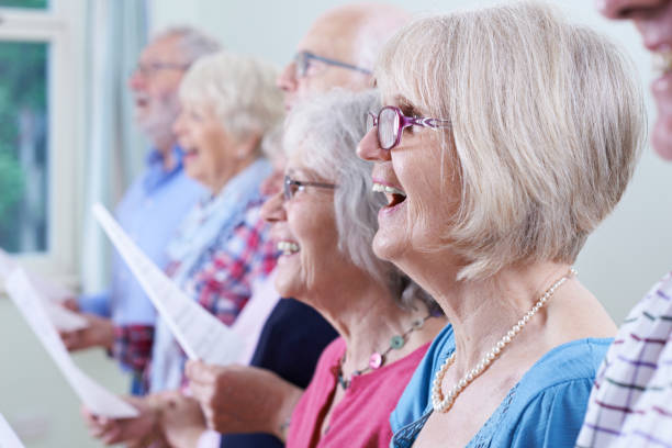 istock Group Of Seniors Singing In Choir Together 649768620