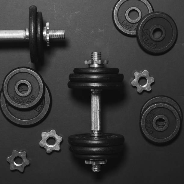 istock Dumbbells or weights on black table - Concept for workout - Flat lay minmal design 649768688