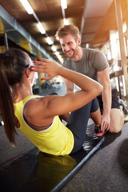 istock Girl exercises with trainer 649768842