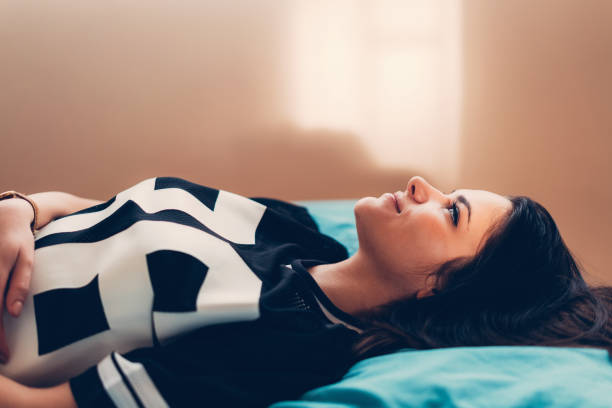 istock Dreamy woman in bed 649773158