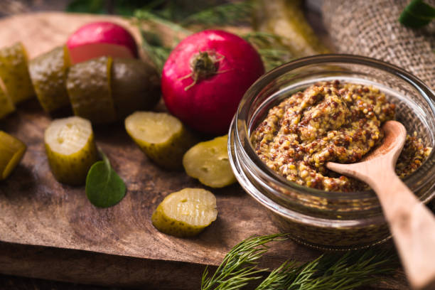 istock Cucumber, radishes, lettuce, mustard, on a cutting board partial blur 649777180