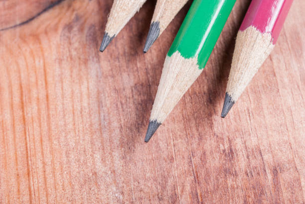 istock Sharpened pencils on wooden background. Close-up 649787434