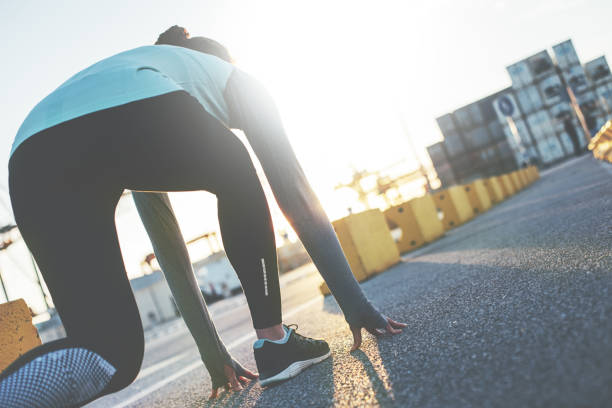 istock Woman in start pose ready for sprint 649792158