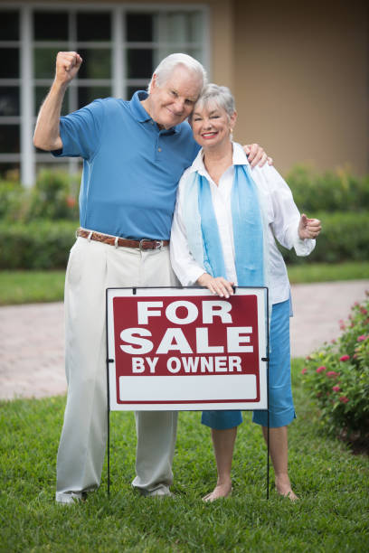 istock Happy senior couple selling house 649792394