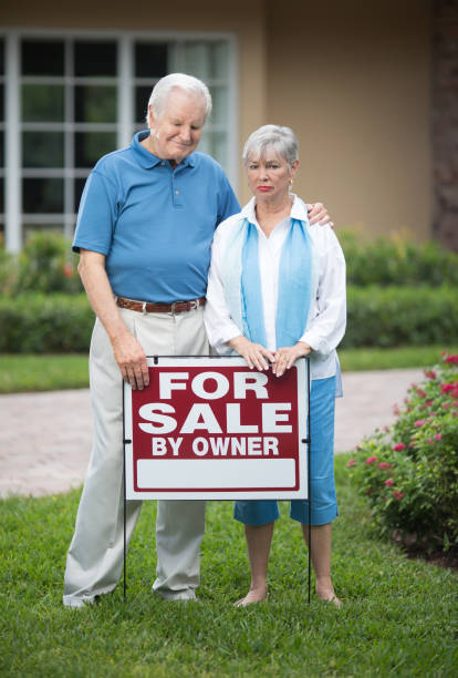 istock Sad senior couple selling house 649792522