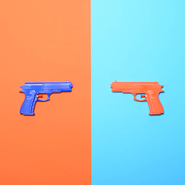 istock Toy pistols on colorful background  - Minimal design top view 649795928