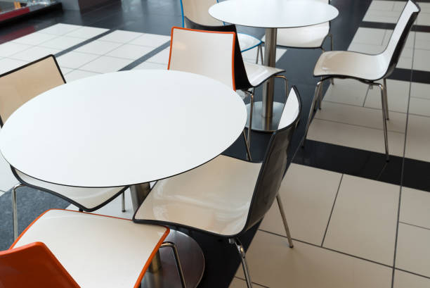 istock White plastic tables and chairs in cafe 649799422
