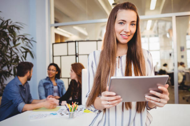 istock Attractive businesswoman using digital tablet in meeting room 649803694