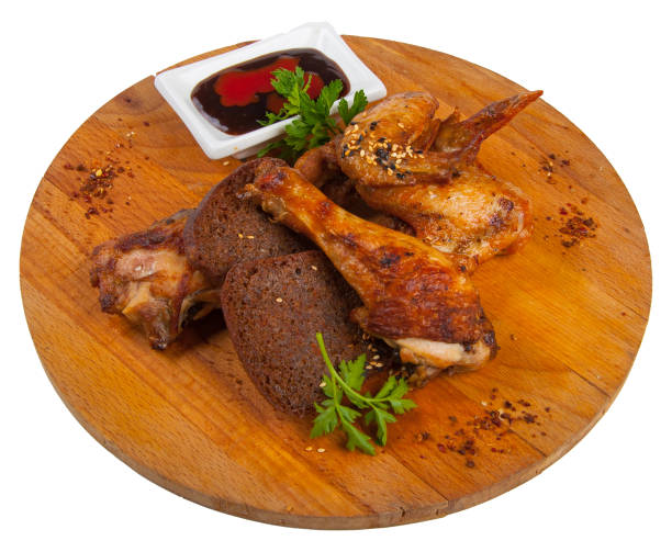 istock hot fried chicken with sauce on a wooden Board 649803702