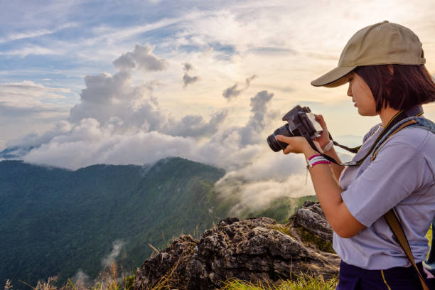 istock Hiker girl looking photo on camera 649803822