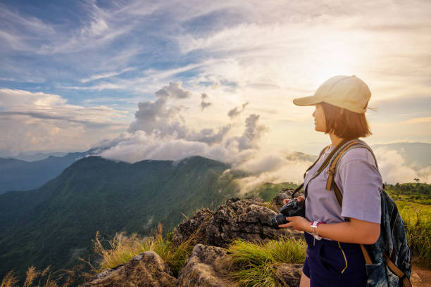 istock Girl tourist on mountains at sunset 649807110