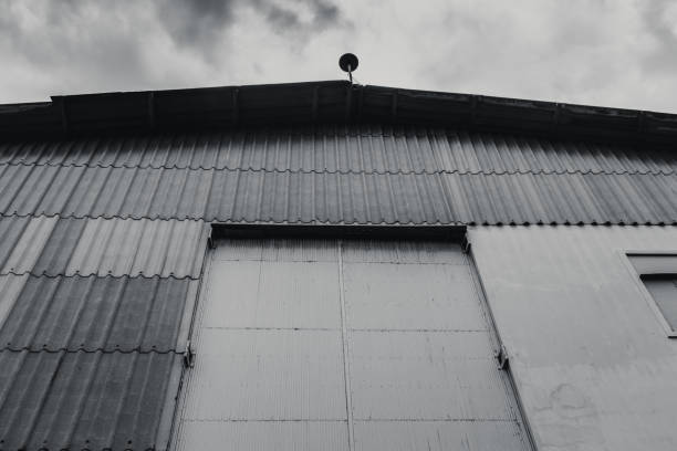 istock old warehouse gate close in black and white color tone 649808392