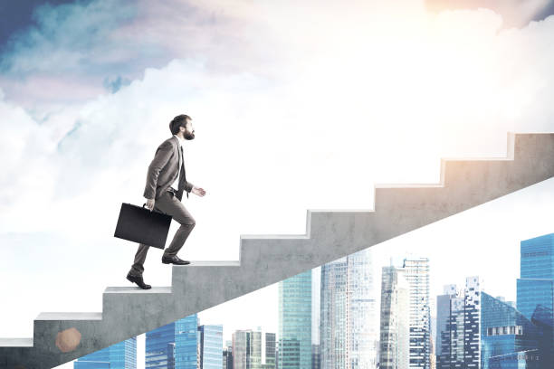 istock Bearded man on the stairs, skyscraper 649813910