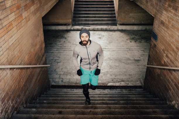 istock Millenial walking up the steps in pedestrian subway 649814186