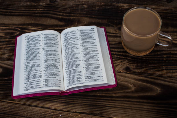 istock bible and coffee with milk on wooden background 649816824
