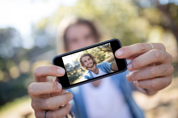 istock Man taking picture of himself on mobile phone 649820886