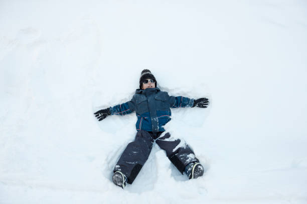 istock spreadeagled boy in snow 649824934
