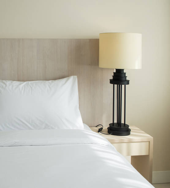 istock Bedroom with lamp on wooden bedside table 649828224
