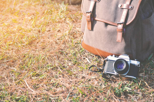 istock Bag and camera in nature 649828850