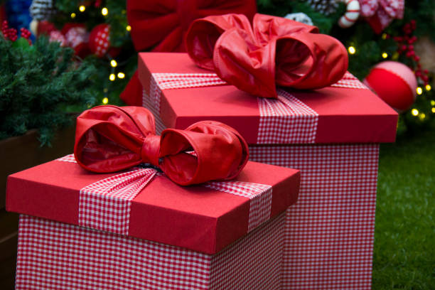 istock Christmas gifts from below the decorative tree. Decorative gift box. 649830130