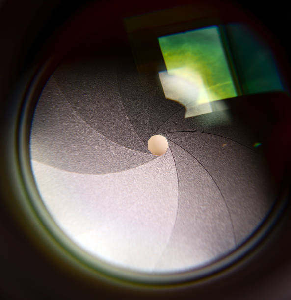 istock Diaphragm of a camera lens aperture macro shot 649836214