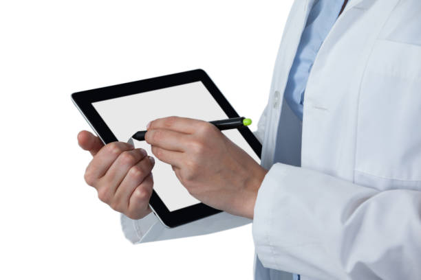 istock Mid-section of female doctor using digital tablet with stylus 649836508