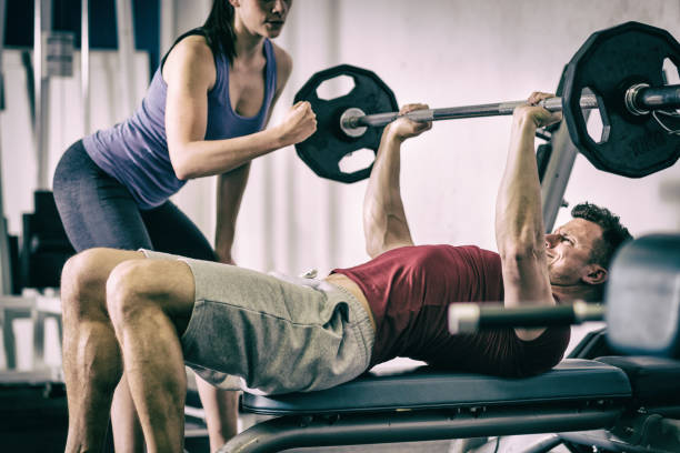istock Sportsman doing bench press at the gym. 649837320