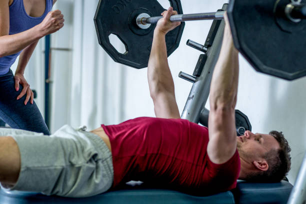 istock Sportsman doing bench press at the gym. 649837332