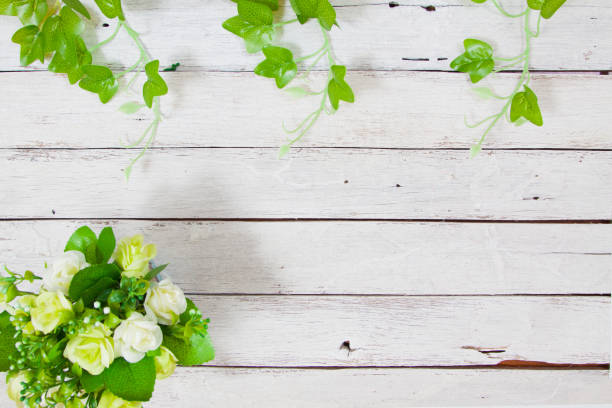 istock flowers on wooden background 649841028