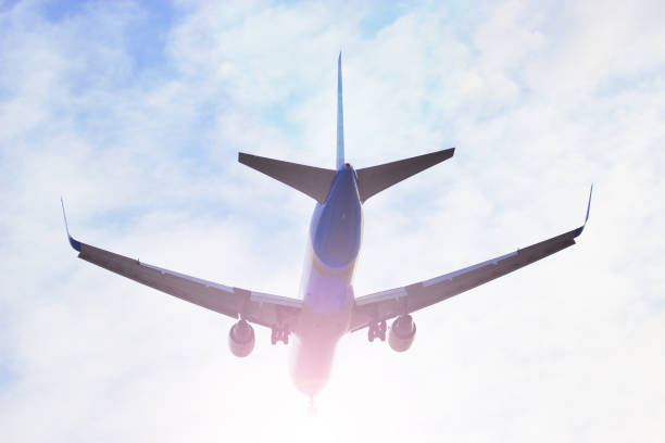 istock Plane flying through clouds in the sky. Jet aircraft. 649847958