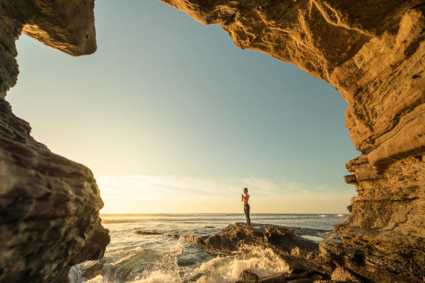 istock Ocean Cave Yoga In Golden Light 649851870
