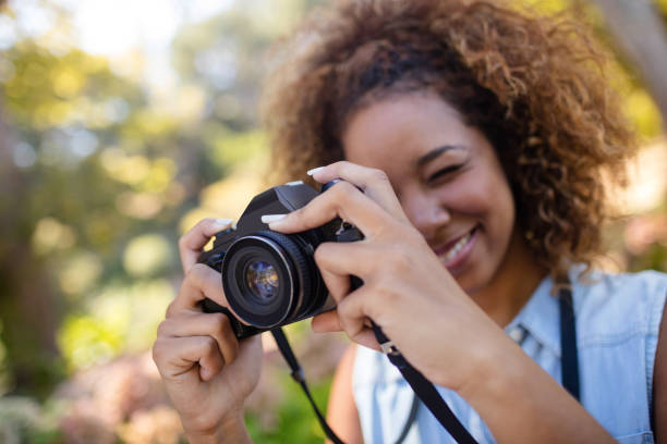 istock Woman taking picture with digital camera 649852510