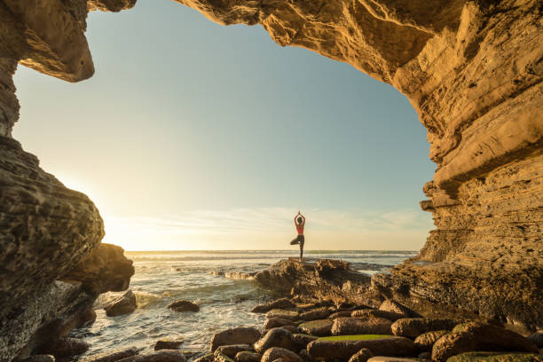 istock Ocean Cave Yoga In Golden Light 649855764