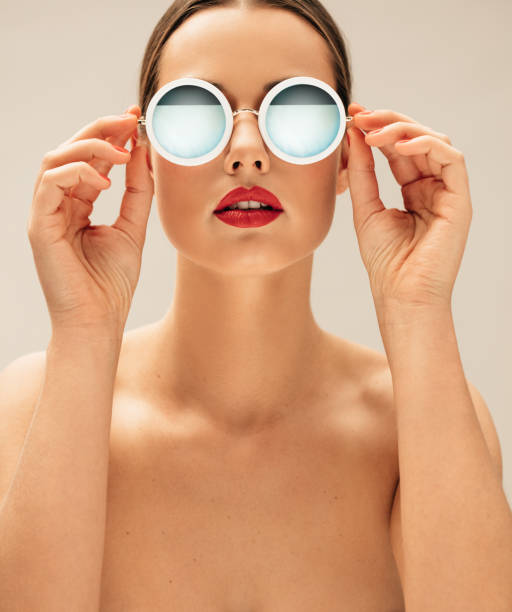 istock Shirtless female model wearing sunglasses 649859490