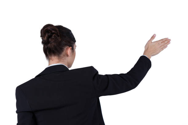 istock Rear view of businesswoman using digital screen 649860222