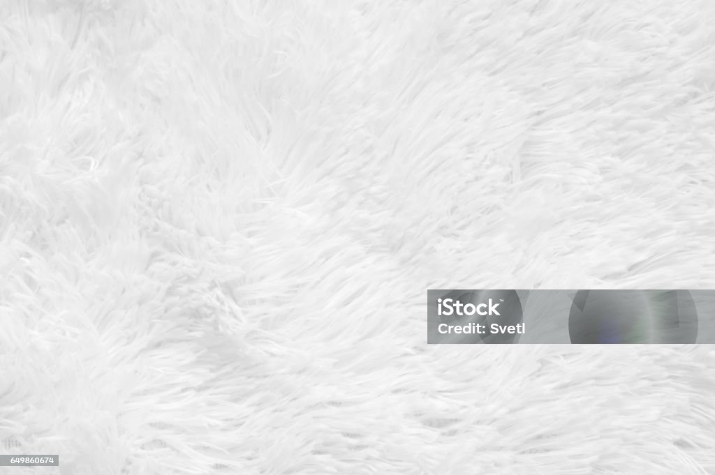 Shaggy fur texture White shaggy blanket texture as background. Fluffy fake textile fur. Abstract Stock Photo