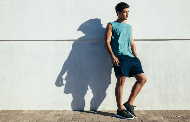 istock Fit young male relaxing after running exercise 649864762