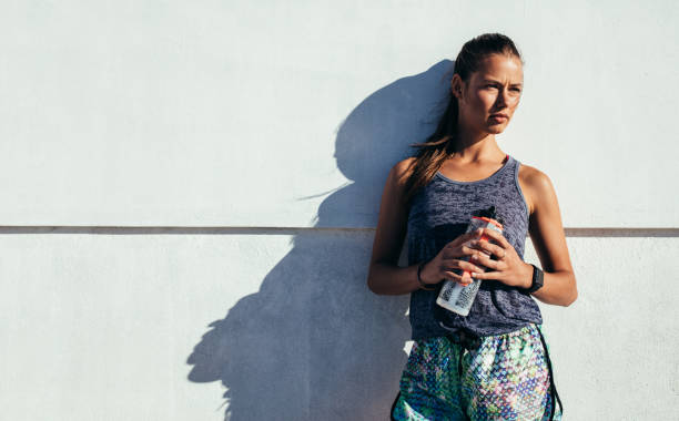 istock Sportswoman relaxing after exercising 649866936