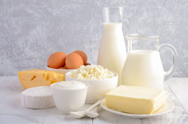 istock Fresh dairy products. Milk, cheese, brie, Camembert, butter, yogurt, cottage cheese and eggs on wooden table. 649867708