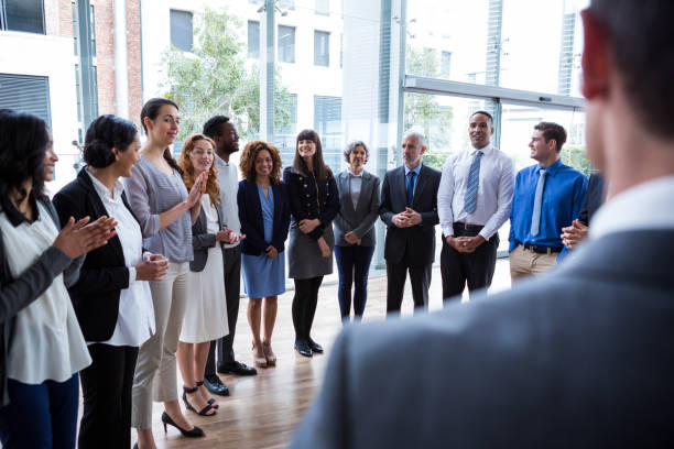 istock Businesspeople applauding on their colleagues presentation 649881682