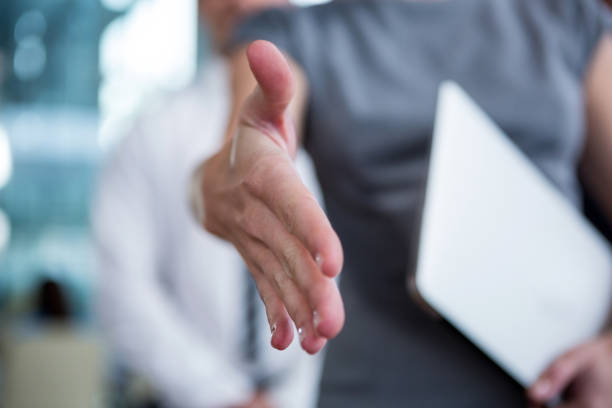 istock Businesswoman shaking hand 649881764