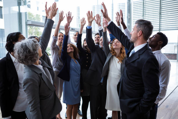 istock Business people raising their arms 649881820