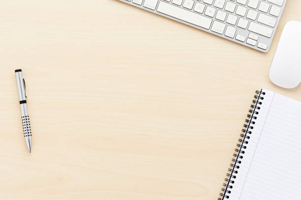 istock Keyboard, mouse, notepad and pen on light wooden desk with copy space 649882494