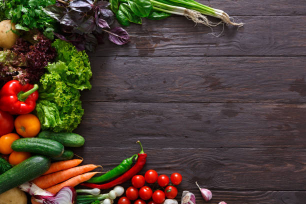 istock Frame of fresh vegetables on wooden background with copy space 649883032