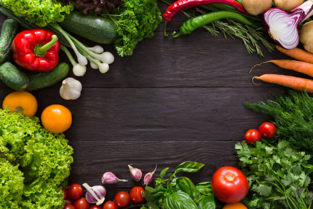 istock Frame of fresh vegetables on wooden background with copy space 649885712