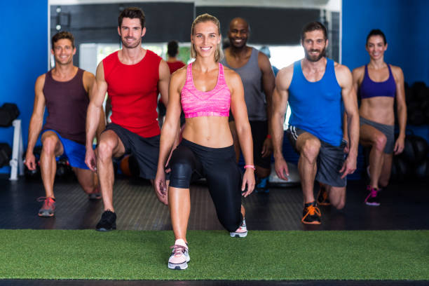 istock Portrait of smiling athletes exercising 649885714
