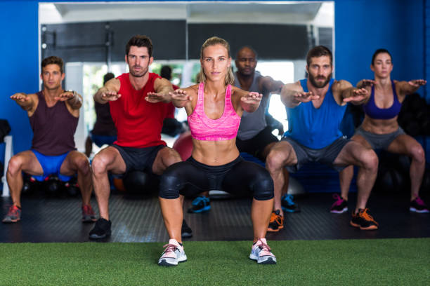 istock Athletes exercising in gym 649885742