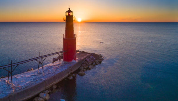 istock Lake Michigan Sunrise out beyond iconic Lighthouse. 649894220