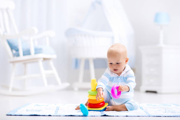 istock Baby playing with toy pyramid. Kids play 649901836