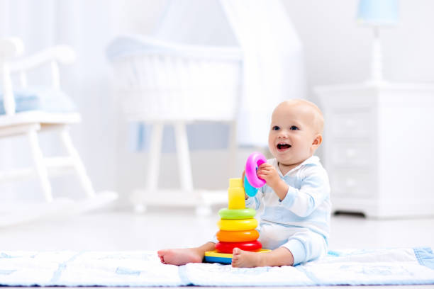 istock Baby playing with toy pyramid. Kids play 649902054